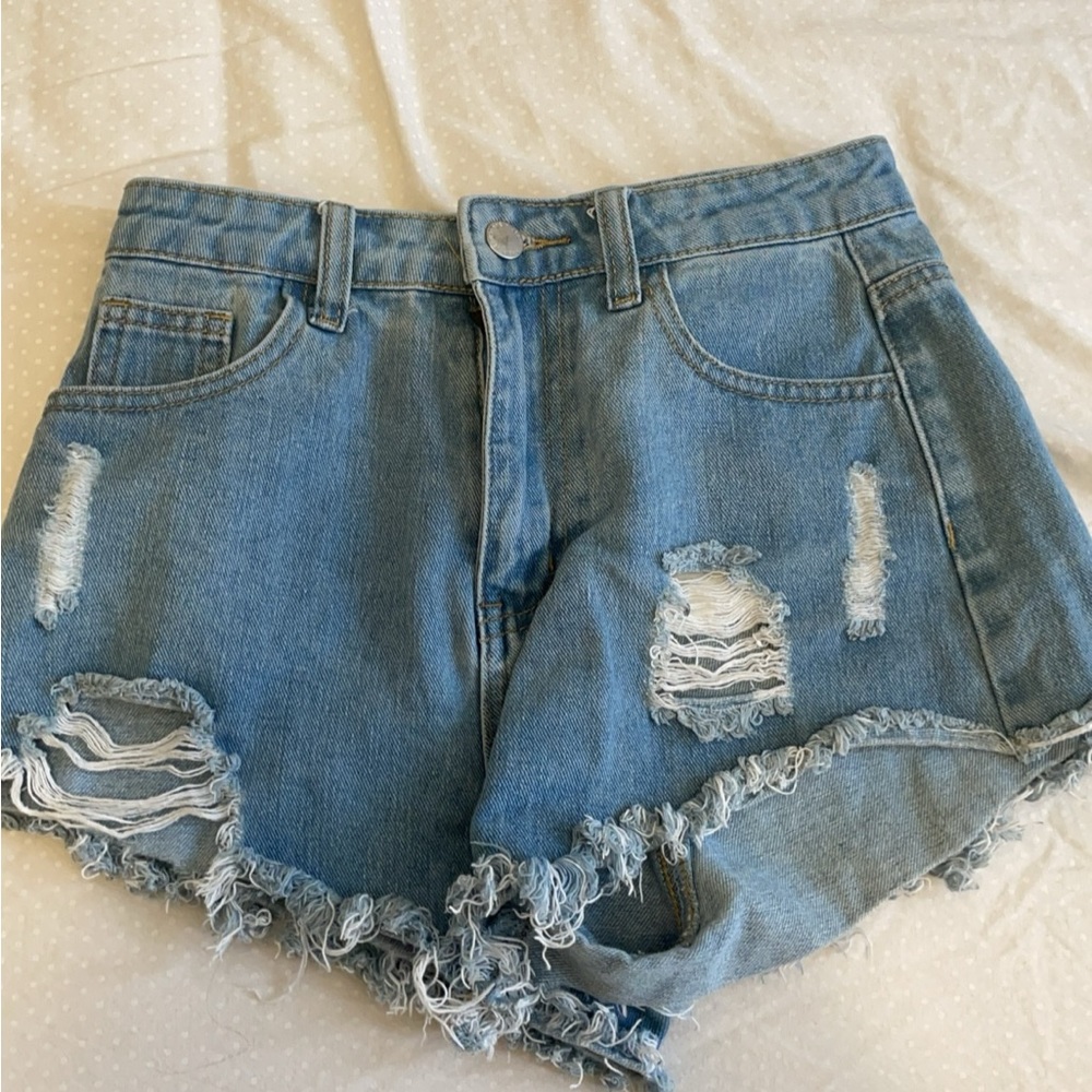 blue, ripped jean shorts,